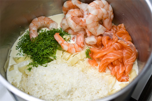 adding the ingredients to the cooked pasta