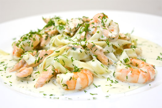 a plate of the finished salmon and prawn pasta