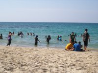 Thais bathing with their clothes on.